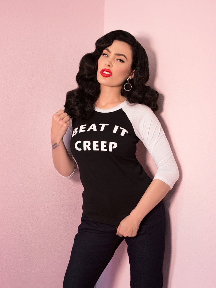 Micheline Pitt looking tough while modeling the Beat It Creep raglan t-shirt by Vixen Clothing.