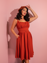 Francesca wearing the Ingenue Swing Dress in Pumpkin Spice from retro dress company Vixen Clothing.