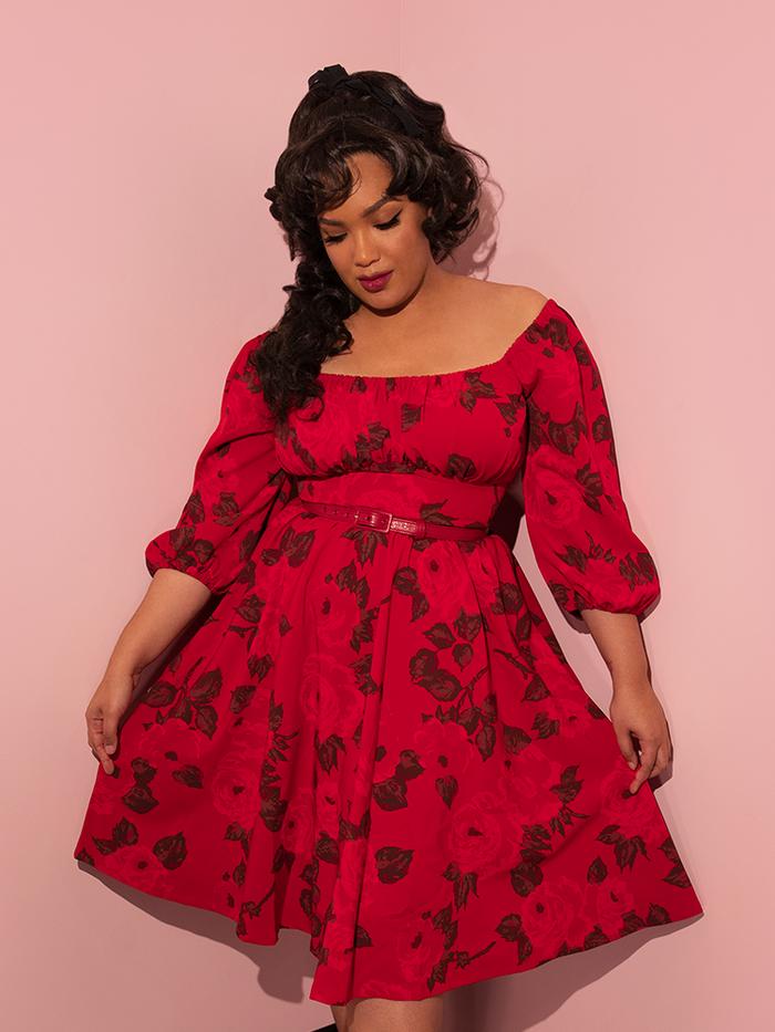 Ashleeta wearing the Vacation Dress in Vintage Red Rose Print from retro dress company Vixen Clothing.