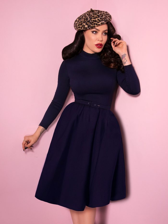 Bad Girl Swing Dress in Navy worn by Micheline Pitt who also is sporting a leopard beret.