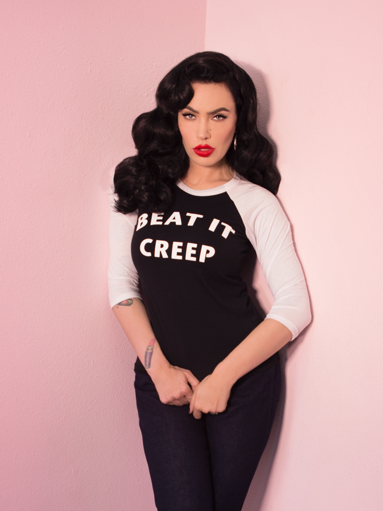 Micheline Pitt looking tough while modeling the Beat It Creep raglan t-shirt by Vixen Clothing.