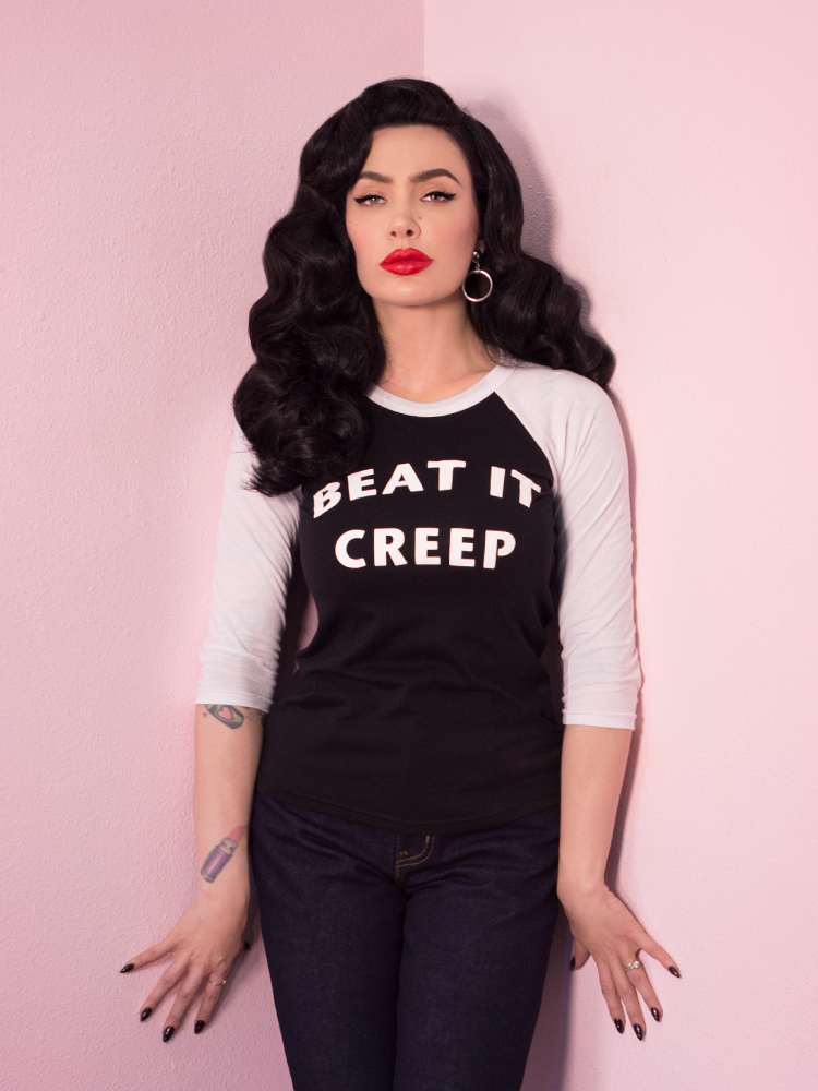 Micheline Pitt models the Beat It Creep raglan t-shirt by Vixen Clothing.