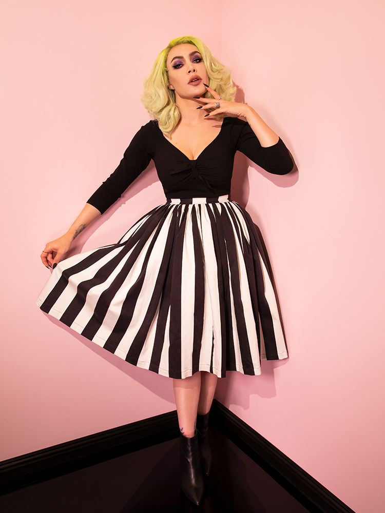 Micheline Pitt pulling out the Ghost Swing Skirt in Black & White Stripes to show off the black and white striped pattern.
