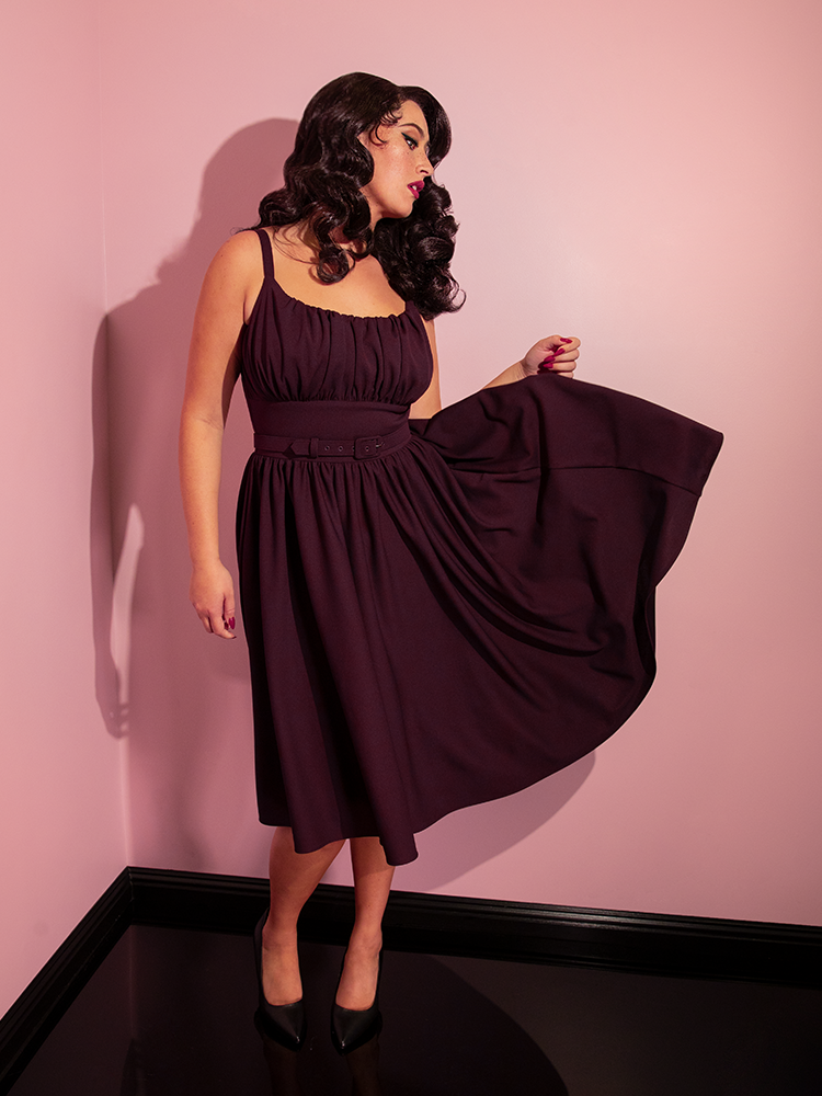 Brittany shows off the Ingenue Swing Dress in Eggplant Purple - a moody and gorgeous dress from retro clothing company Vixen Clothing.