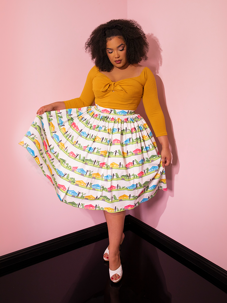 Full length shot of female model wearing the EDWARD SCISSORHANDS Swing Skirt in Suburban Topiary Novelty Print with a tucked in low cut retro stop.