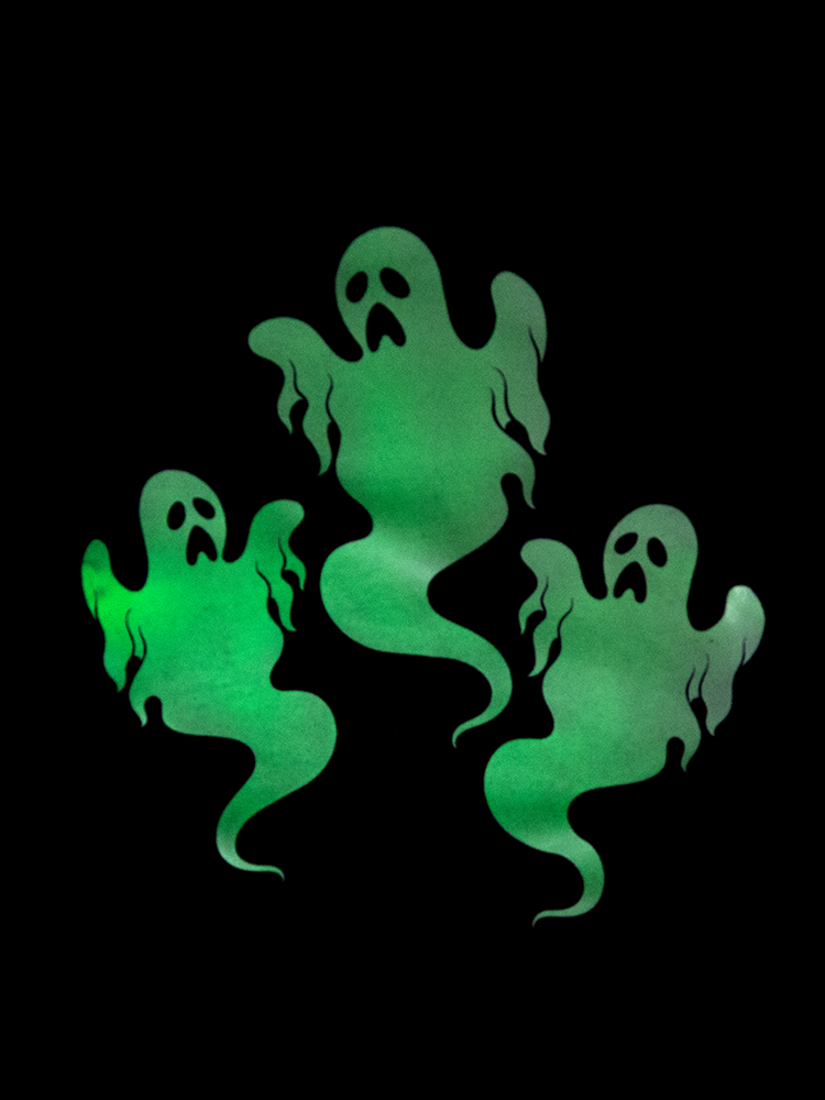 Up close shot of the glow in the dark ghost print featured on this retro clothing top from Vixen.