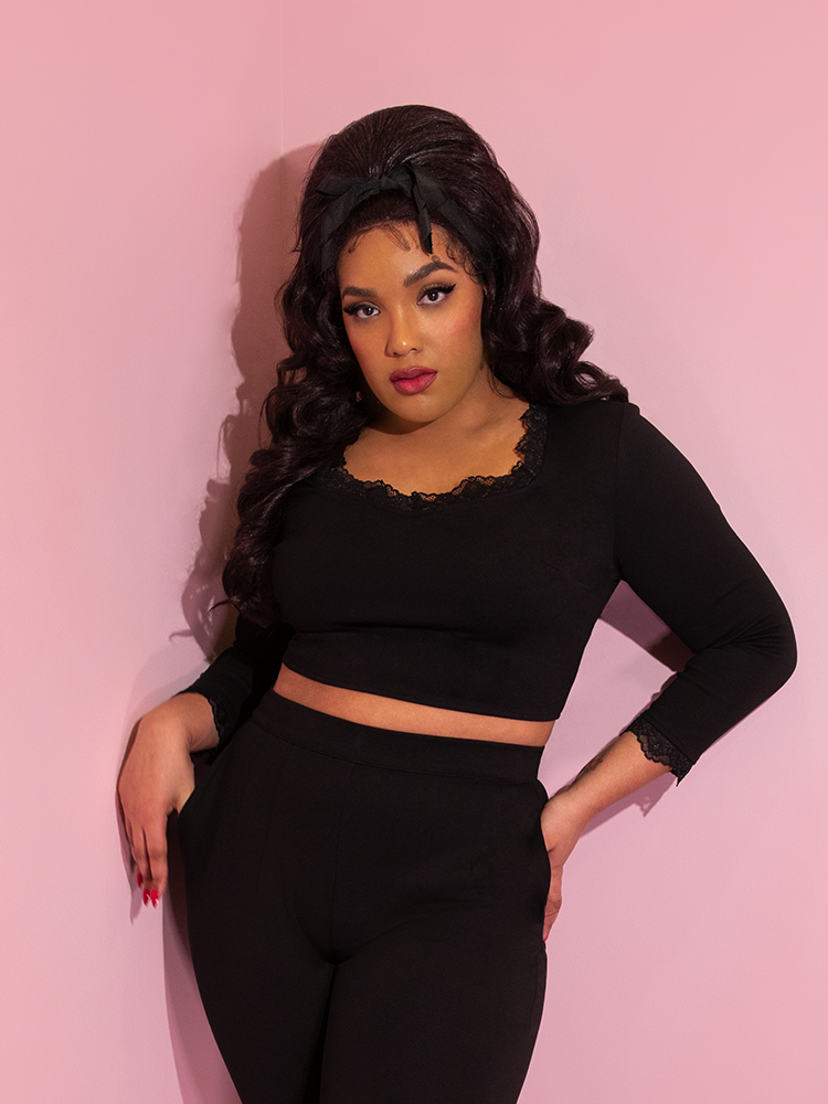 A closeup of Ashleeta modeling the Vixen Clothing Hollywood crop top paired with matching black pants.