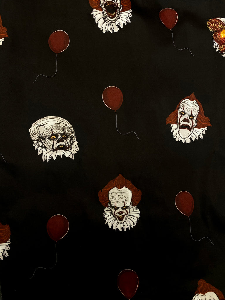 A closeup of the print of the Pennywise ringer tee by Vixen Clothing.