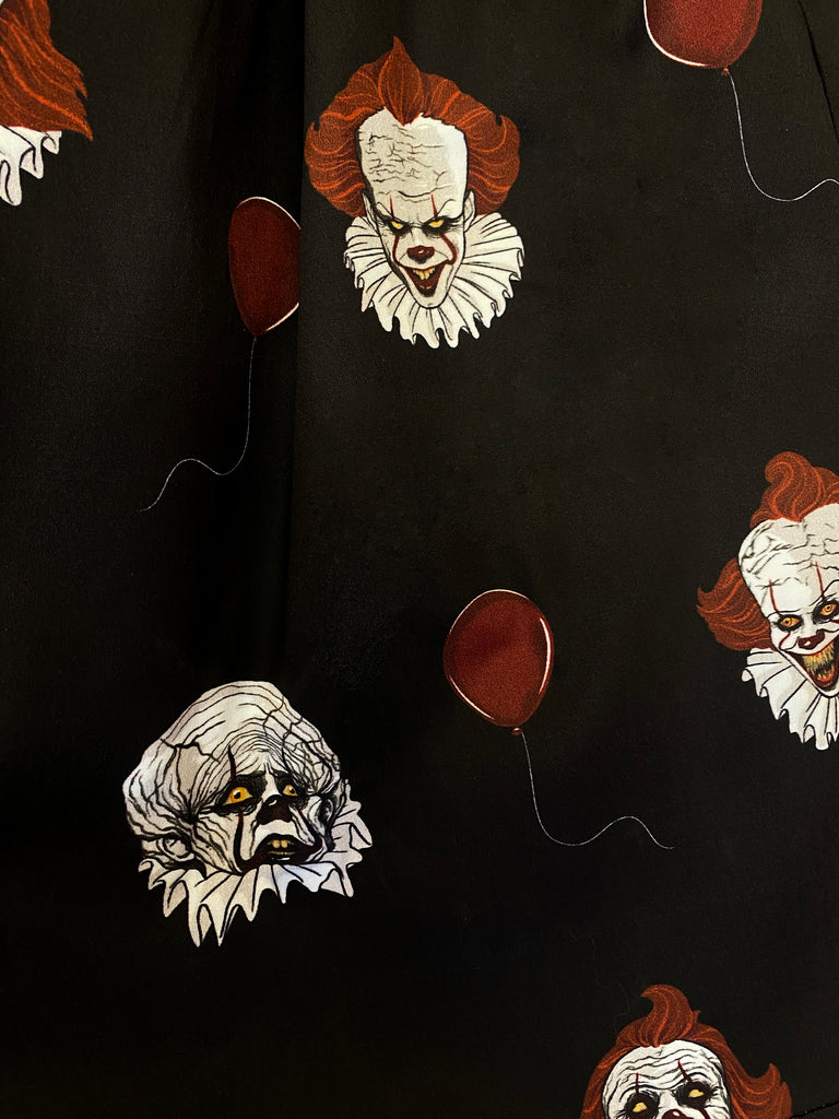 A closeup of the print on the Pennywise swing skirt in black by Vixen Clothing.