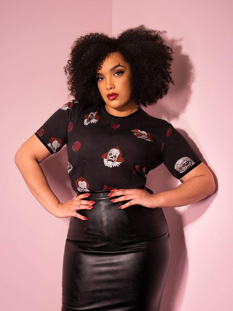 A closeup of Ashleeta modeling the Pennywise ringer tee by Vixen Clothing.
