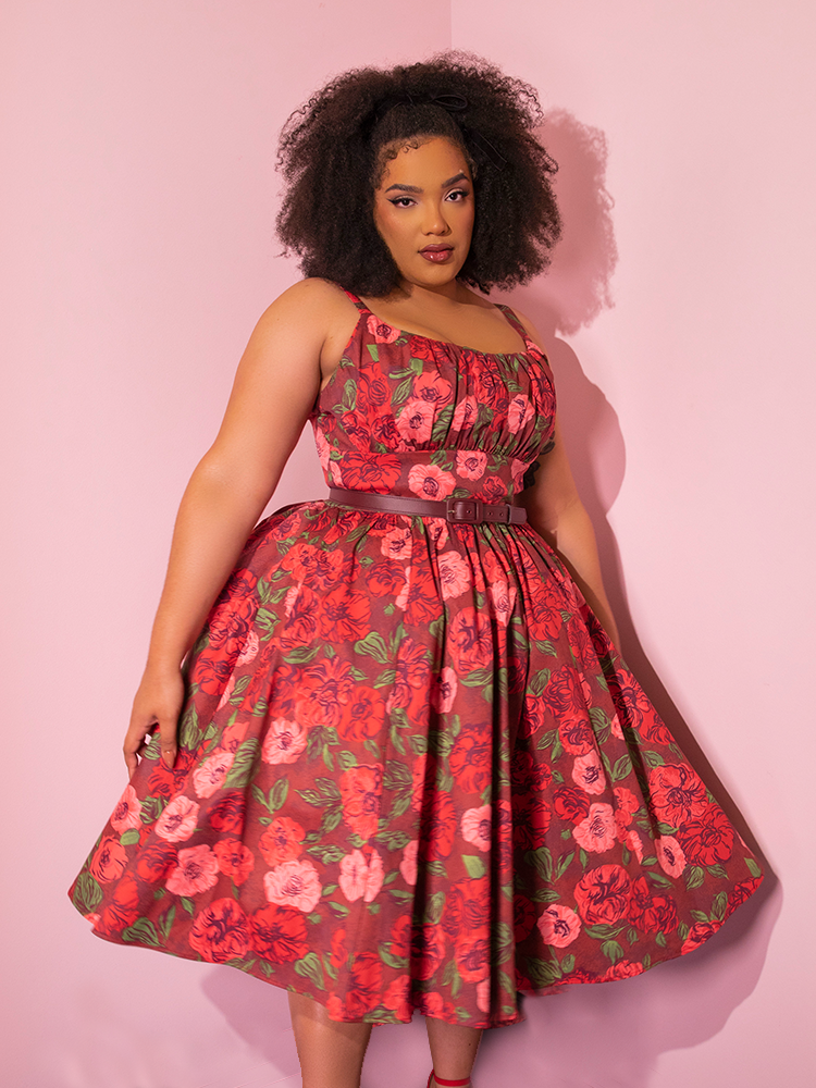 African-American female model wearing the Ingenue Dress in Chocolate Rose Print from Vixen Clothing.