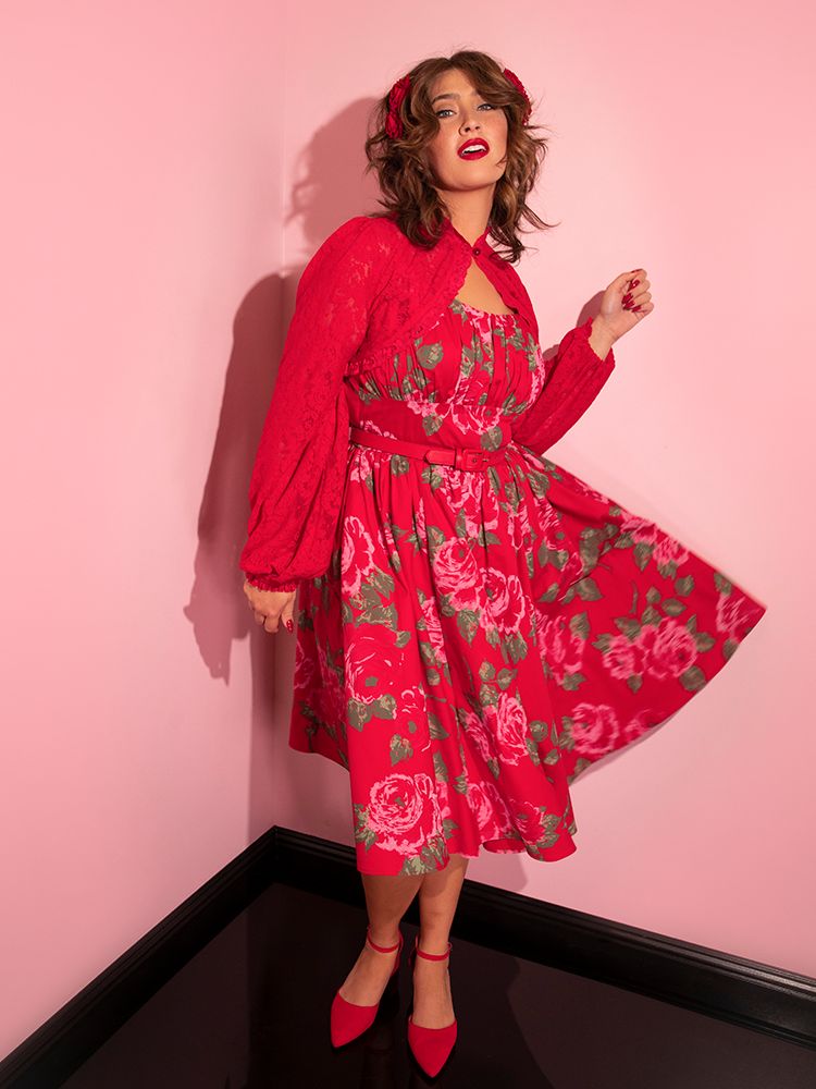 Francesca dances in the Ingenue Swing Dress in Vintage Red Rose Print from Vixen Clothing.