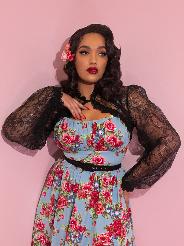 Ashleeta pairs her Vixen Vintage Lace Bolero in Black with a floral print retro dress - all items from Vixen Clothing.
