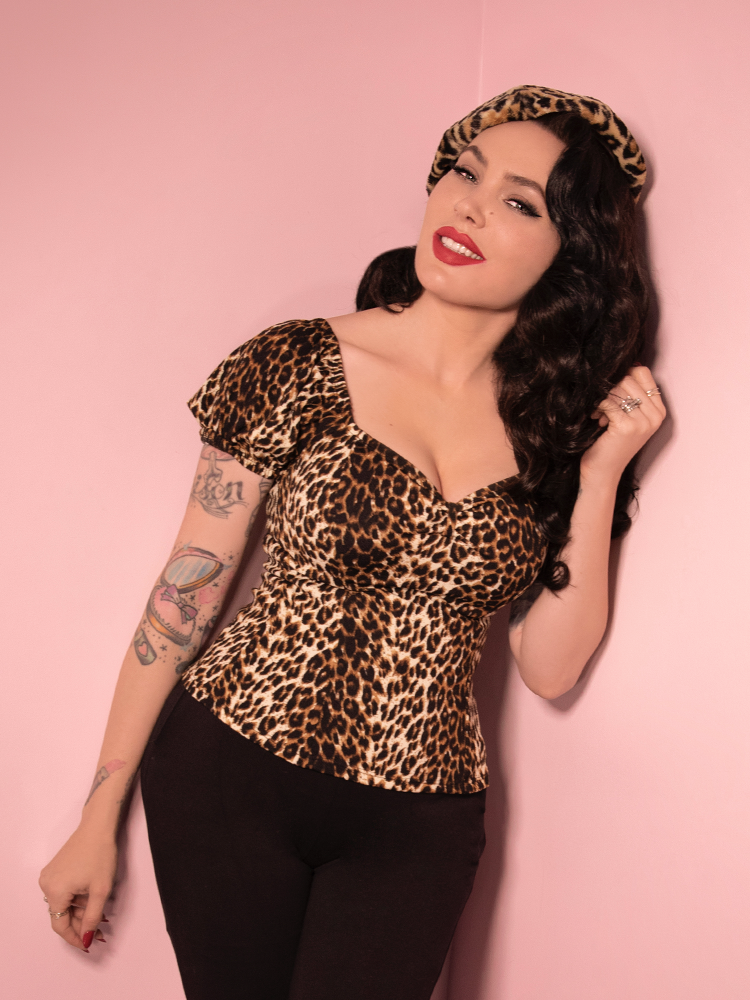 Micheline Pitt embodies the fierce and fearless spirit of Vixen Clothing in the Wild Leopard Print Powder Puff Top.