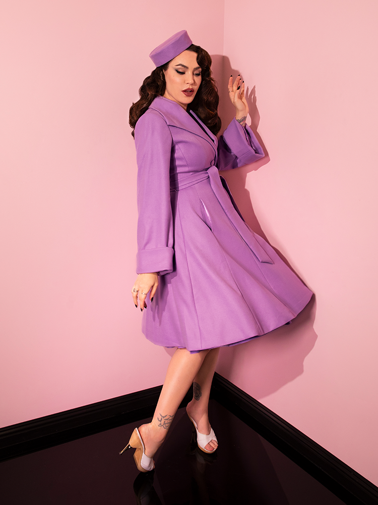 Side shot of Micheline Pitt wearing the The Lili Coat in Lilac.
