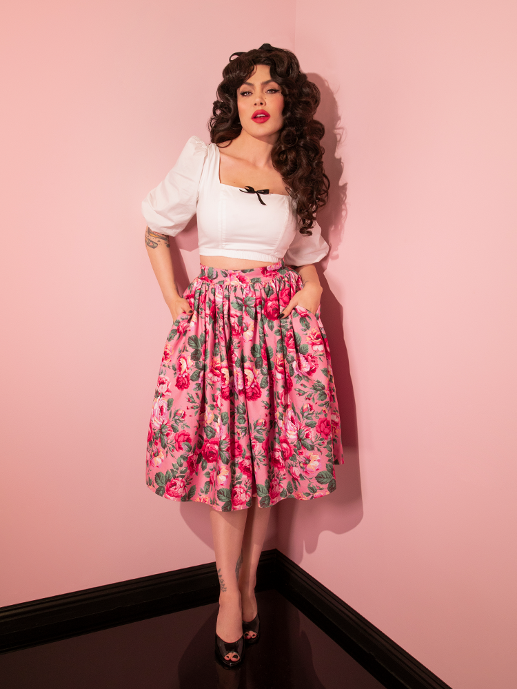 Full length shot of Micheline Pitt in a retro outfit including the Vixen Swing Skirt in Pink Rose Print.