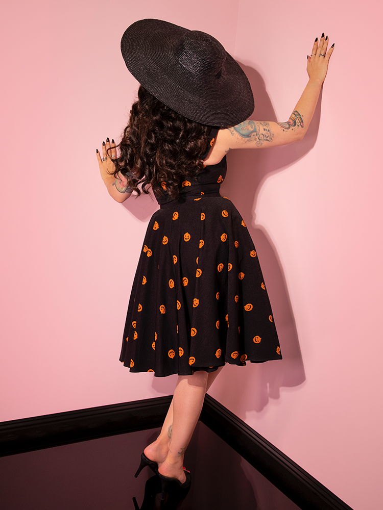 The back of the Pumpkin King Maneater Swing Dress in Black as worn by Micheline Pitt. 