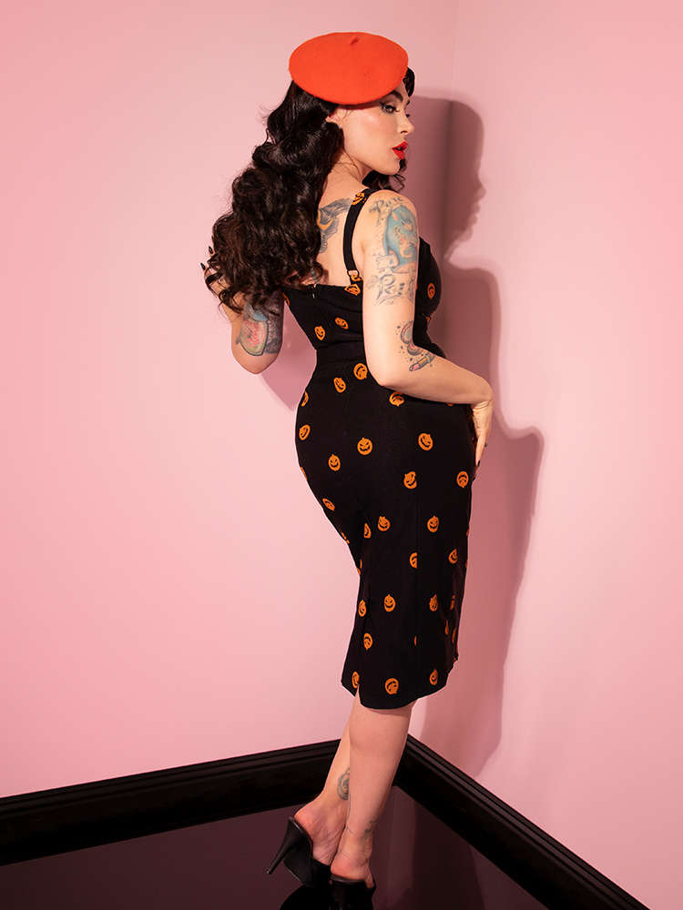 The back of the Pumpkin King Maneater Wiggle Dress in Black as modeled by Micheline Pitt.