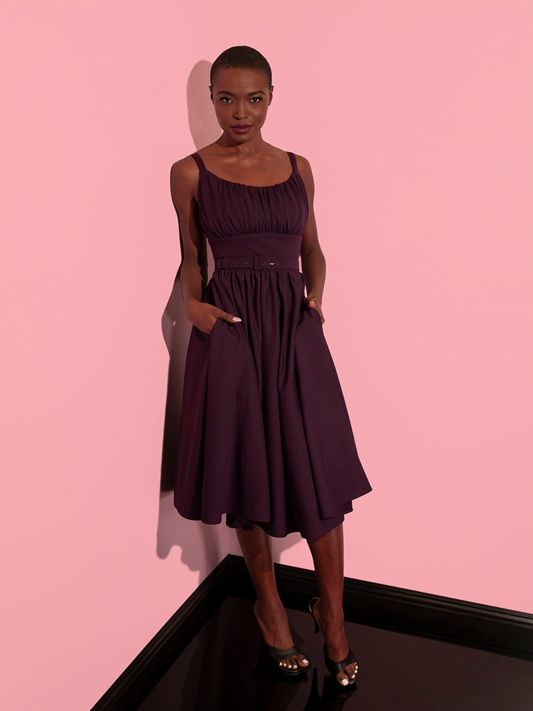 Full length shot of model wearing retro inspired dress from Vixen Clothing.