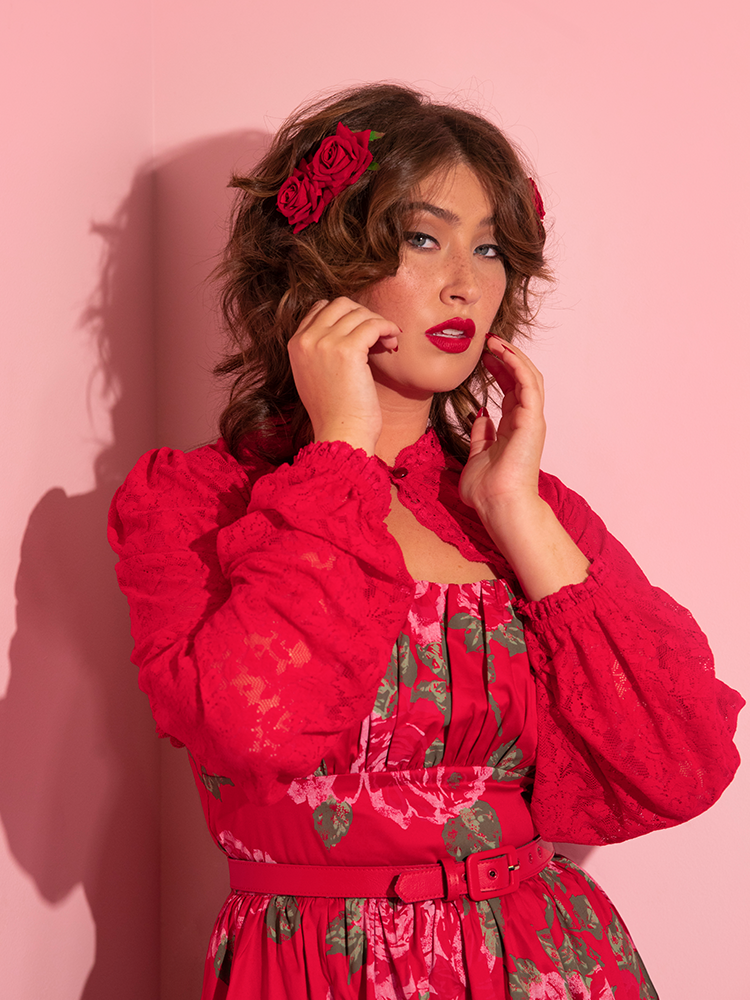 Francesca wears the Vixen Vintage Lace Bolero in Classic Red from vintage style clothing brand Vixen Clothing.