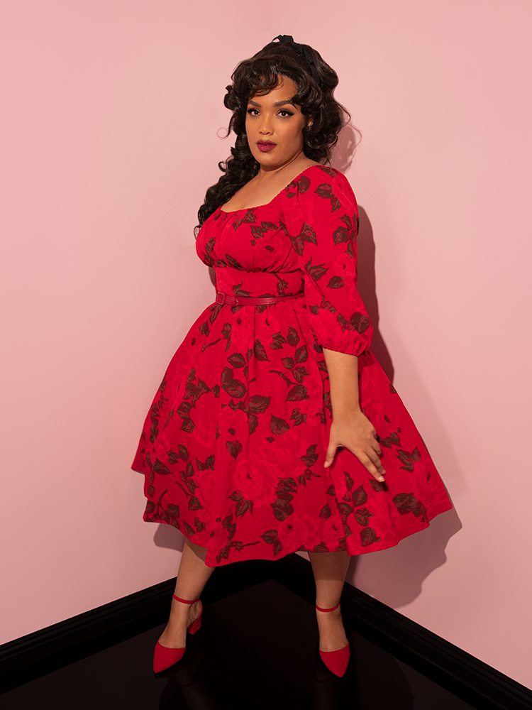 Ashleeta twirls while wearing the Vacation Dress in Vintage Red Rose Print.