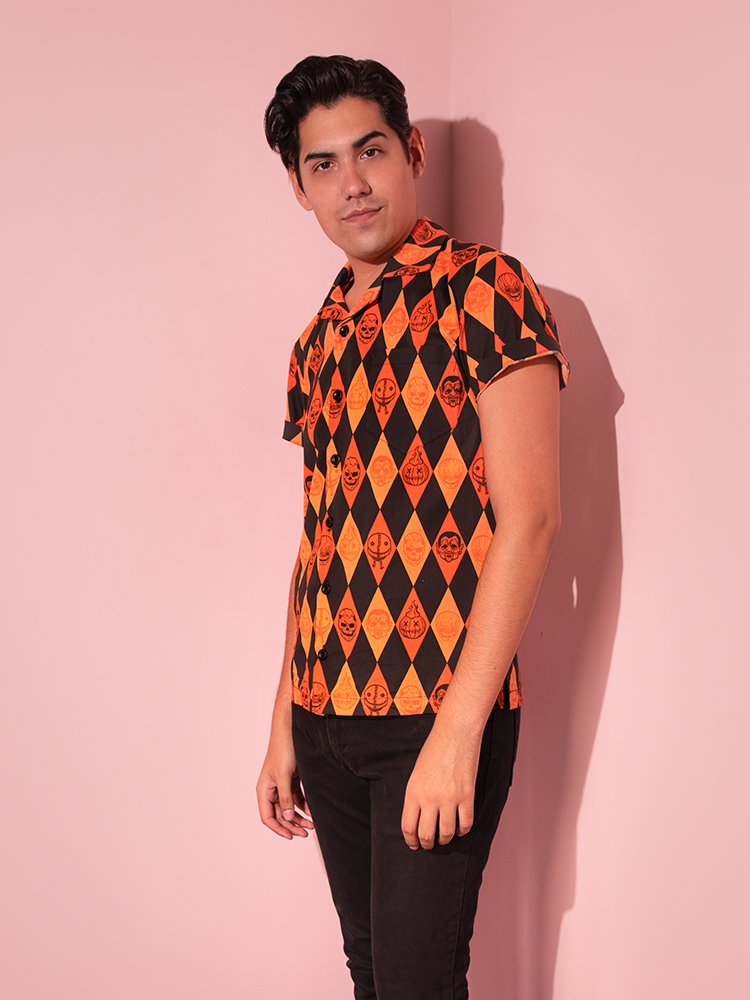 The TRICK R TREAT™ Button Up Shirt in Halloween Harlequin Print with black jeans. 