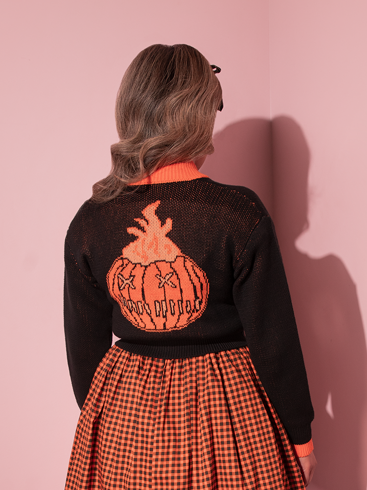 The back of the TRICK R TREAT™ Flaming Pumpkin Cropped Knit Jacket from retro clothing brand Vixen Clothing.