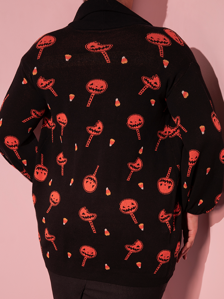 Close up of the pattern on the TRICK R TREAT™ Candy Corn Cardigan.
