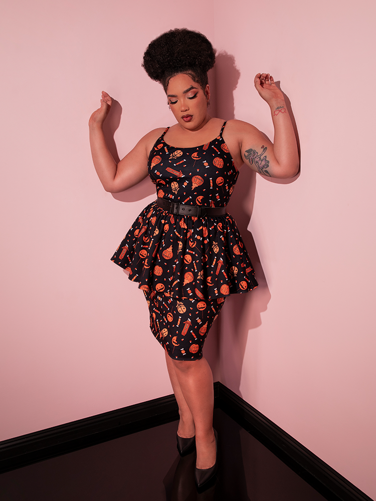 The TRICK R TREAT™ Peplum Wiggle Dress in Candy Corn Novelty Print being worn by female model.