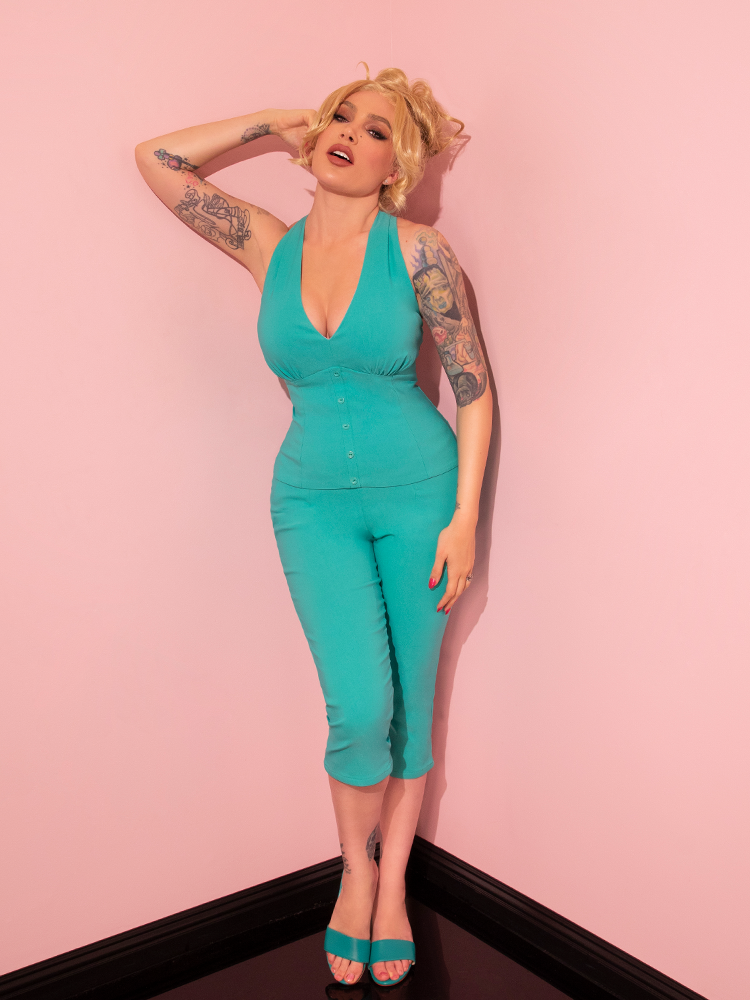 Elegance and sophistication define the look of a vintage-style model in the Capri Pants in Turquoise from Vixen Clothing's retro collection.
