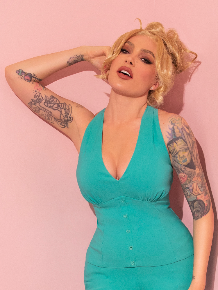 Celebrate the timeless allure of yesteryears with the True Romance Top in Turquoise, lavishly displayed on a breathtaking mannequin, courtesy of the revered Vixen Clothing, the ultimate vintage curator.