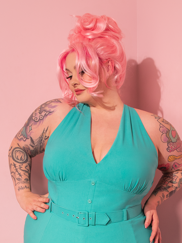Transport yourself back in time as you witness the exquisite beauty of a vintage vixen draped in the True Romance Top in Turquoise, a gem from the treasure trove of Vixen Clothing.