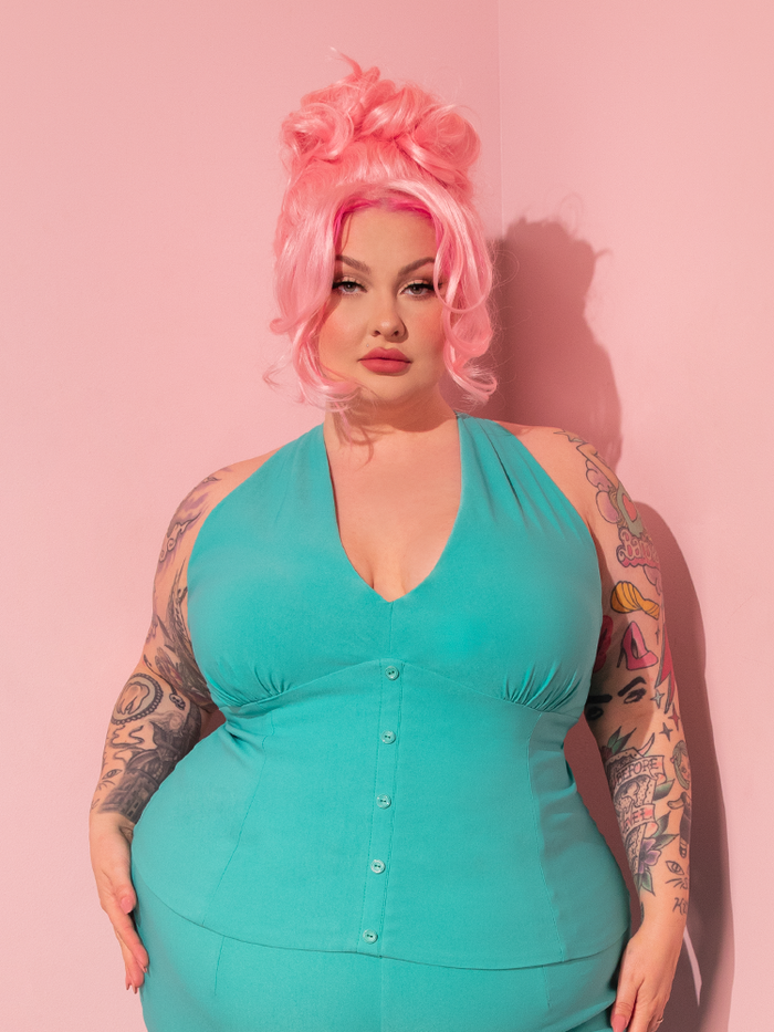 Behold the stunning retro goddess donning the True Romance Top in Turquoise, courtesy of Vixen Clothing, the timeless vintage emporium.