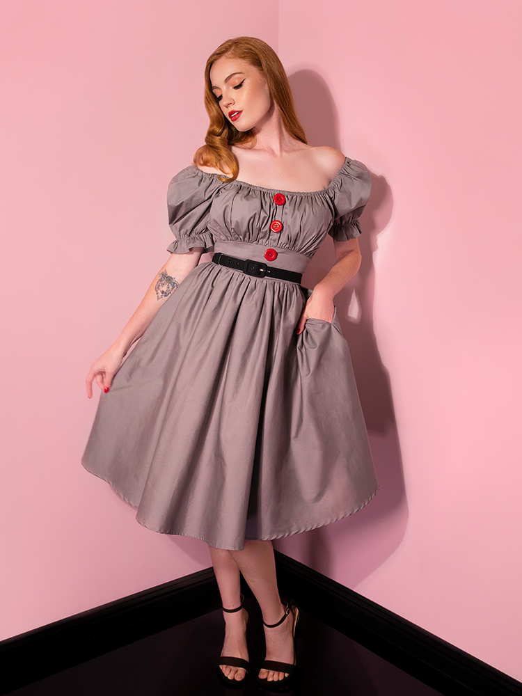 Emily models the versatile Pennywise babydoll dress from Vixen Clothing with the sleeves off the shoulder.