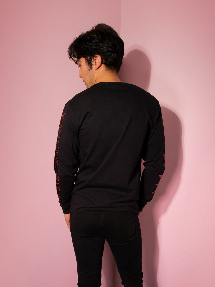Facing away from the camera, model Ethan features the back of the Pennywise Georgie boat tee by Vixen Clothing.