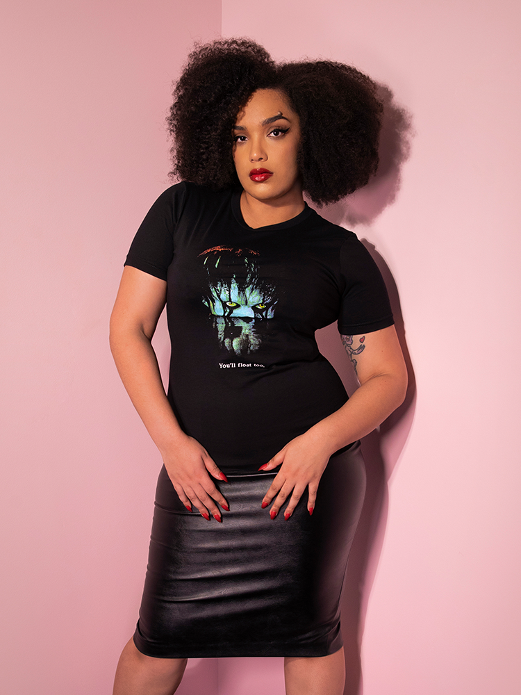 Model Ashleeta is showing off the Pennywise float tee by Vixen Clothing untucked.