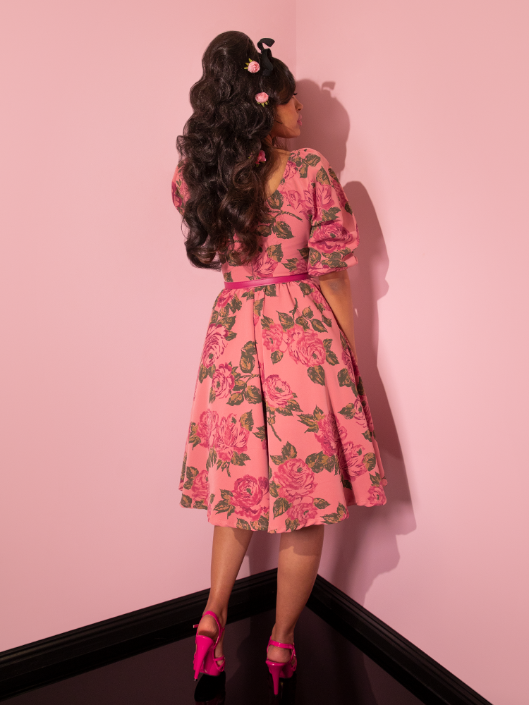 The back of the Vacation Dress in Blush with Pink Roses being worn by Danelly. 