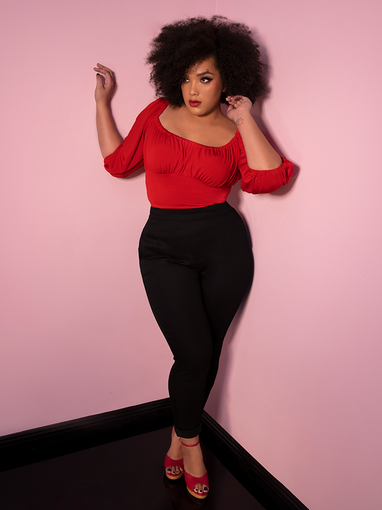 Full body shot of Ashleeta posing in the Vacation Blouse in Red from Vixen Clothing.