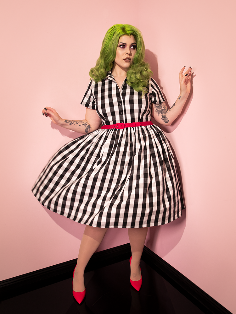 Green haired model spinning around in the BEETLEJUICE™ Adam Maitland Shirt Dress.