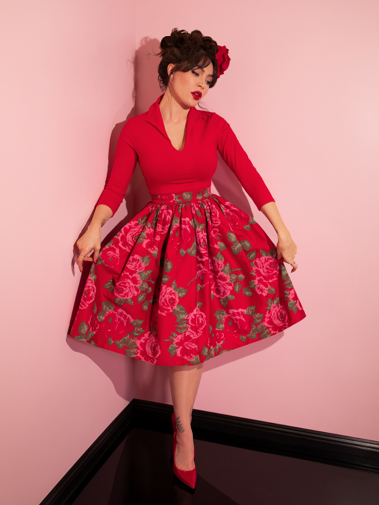 Full length shot of Micheline Pitt modeling an all red retro style outfit.