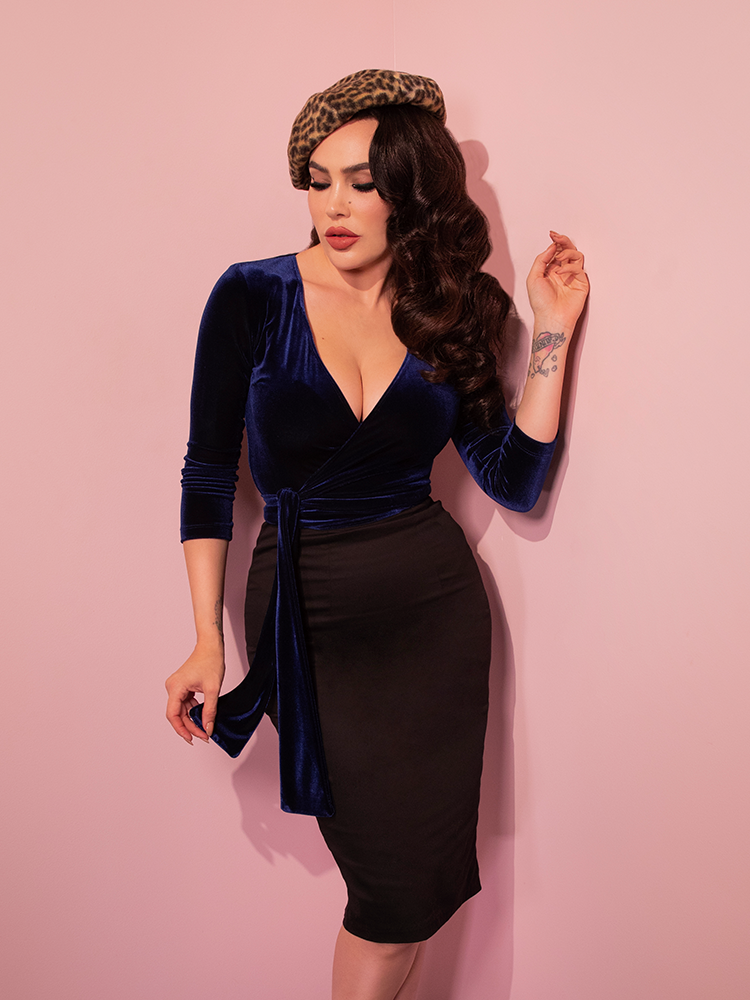 The Wrap Top in Midnight Blue Velvet and black retro skirt modeled by Micheline Pitt for Vixen Clothing perfectly capture retro chic.