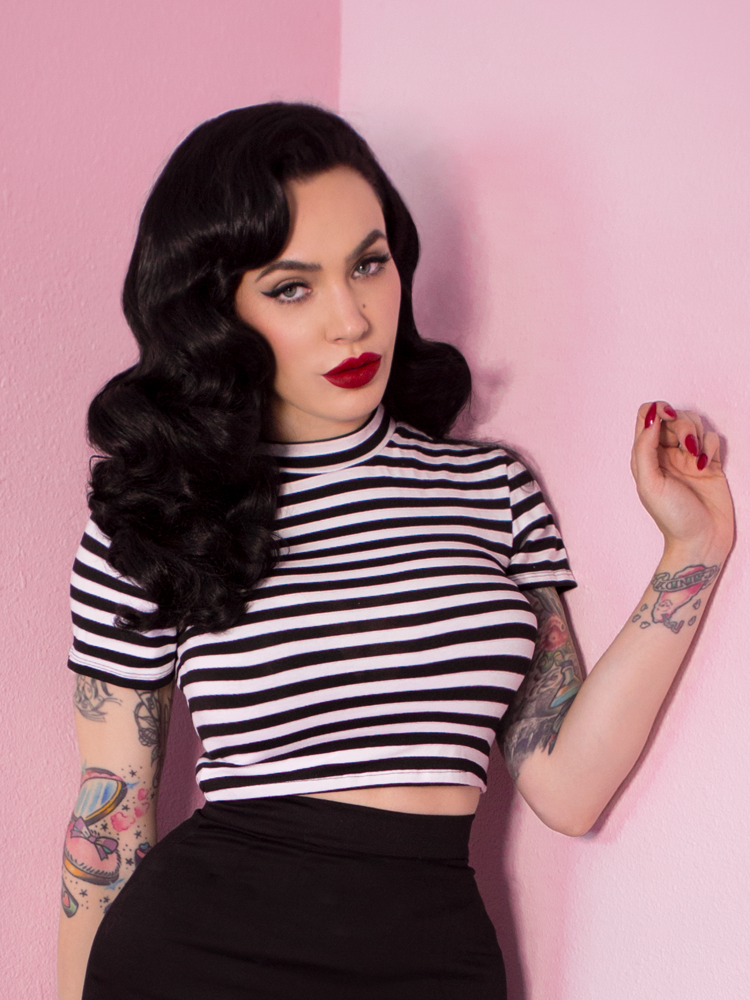 Micheline Pitt modeling the Bad Girl Crop Top in Black and White Stripes.