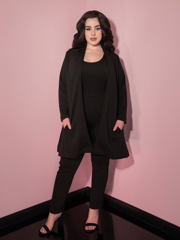 Rachel Sedory tucking her hands into the pockets of the Cozy Cardigan Coat in Black.
