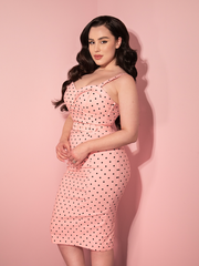 Rachel Sedory wearing the Maneater Wiggle Dress in Rose Pink Polka Dot from Vixen Clothing.