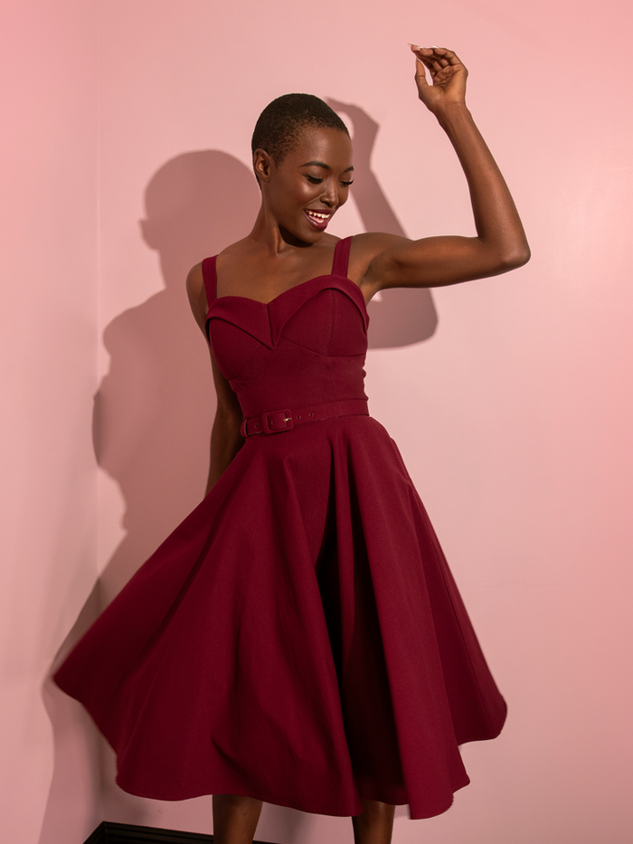 The Maneater Swing Dress in Burgundy from retro style dress company Vixen Clothing.