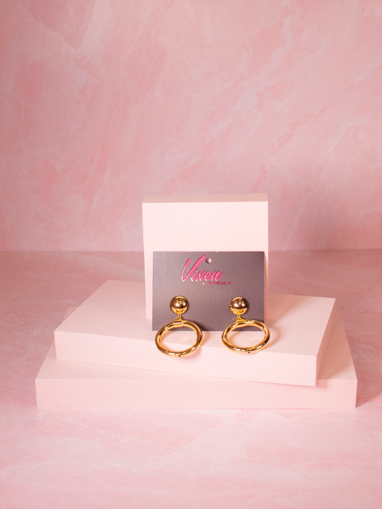The Bad Girl Hoop Earrings in Gold from Vixen Clothing.
