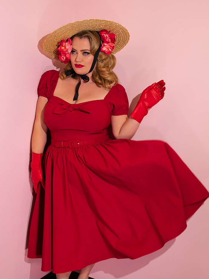 Blondie photographed in the Vixen Swing Dress in Red from retro dress maker Vixen Clothing.